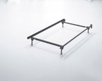 Dark bed frame with metal legs and corner supports, no headboard
