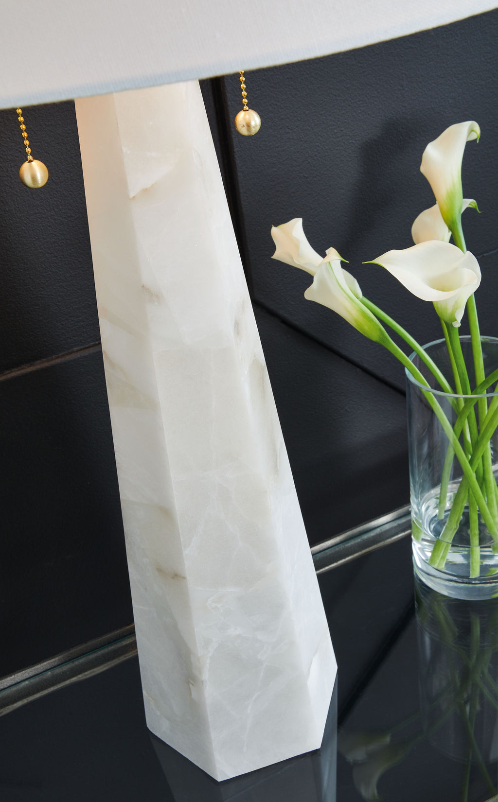 Alabaster-style white table lamp base with gold pull chain and shade edge