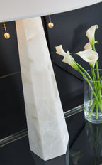 Alabaster-style white table lamp base with gold pull chain and shade edge