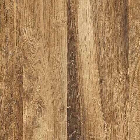 Close-up of brown wood grain on a queen panel footboard.