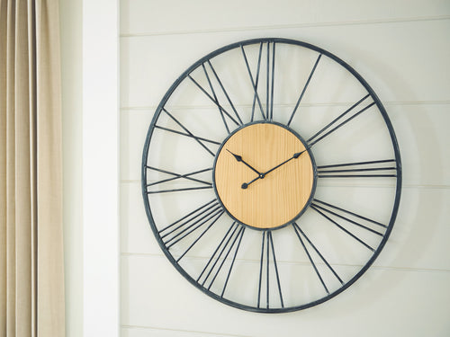Black wall clock with natural wood dial, black metal rim, and long metal hour marks