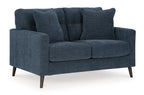 Blue loveseat with tufted back, rolled arms, and two cushioned seat sections.