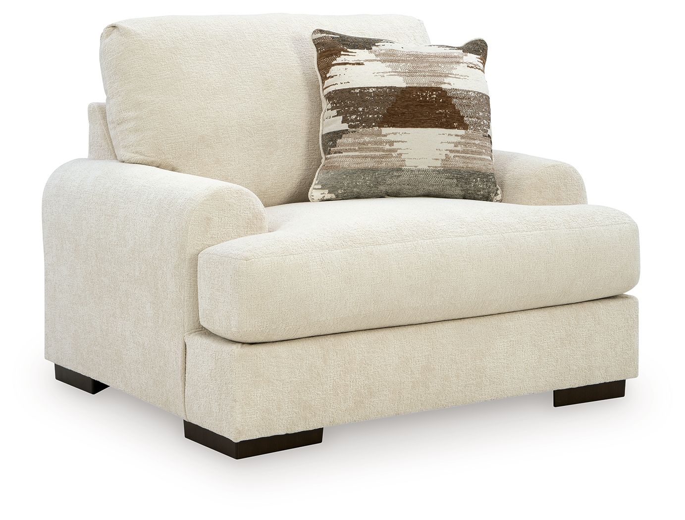Armchair in beige fabric with wide arms, dark legs, and one decorative throw pillow