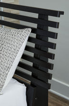 Black slat headboard side view with stacked horizontal bars and post ends