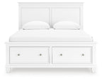 White panel bed with two front drawers and two upholstered pillows against the headboard