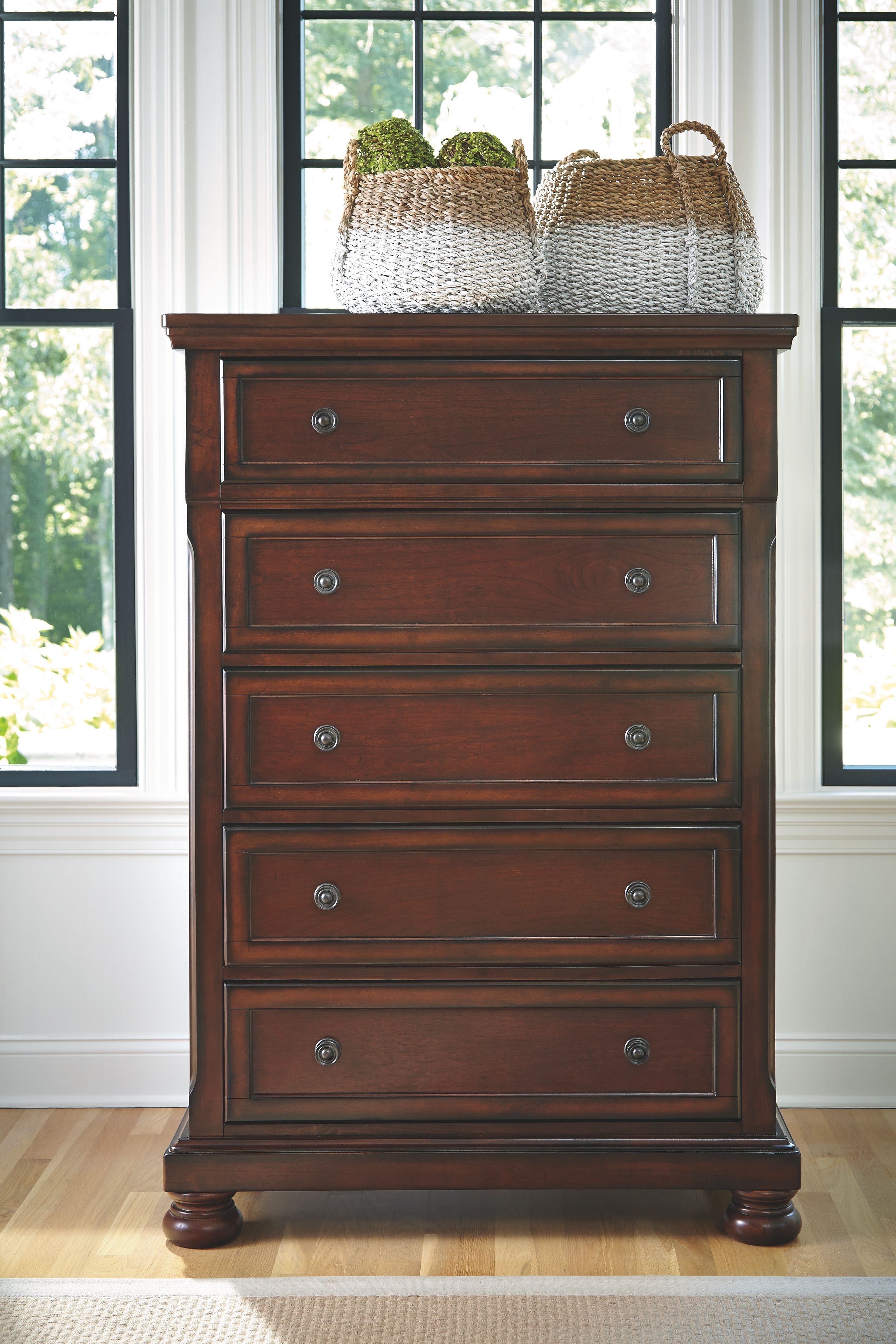 Dark brown dresser cabinet with four rows of drawers and arched top