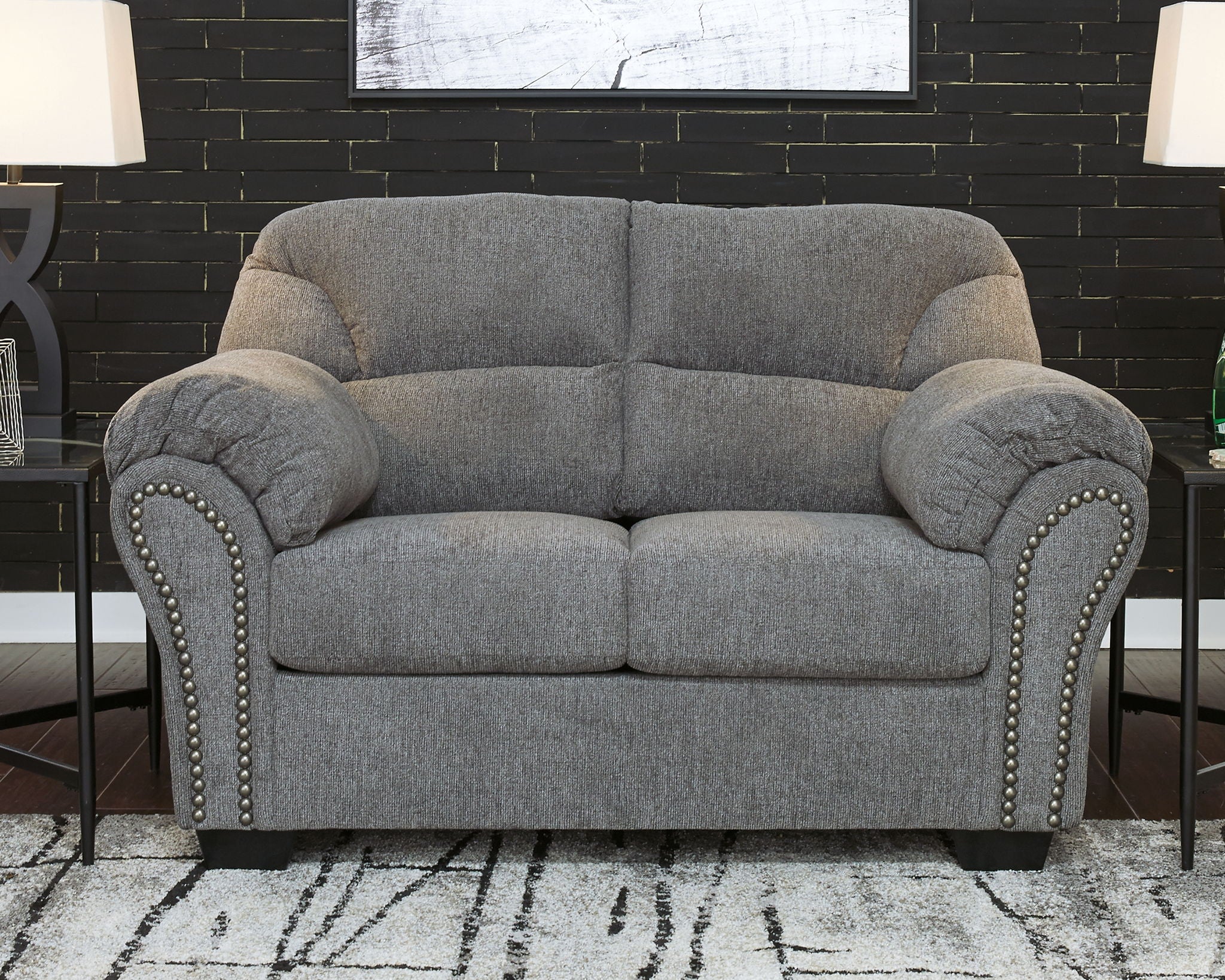 Pewter gray loveseat with nailhead-trimmed arms and two-seat back cushions
