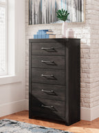 Dark gray five-drawer chest with metal bar handles and tall rectangular frame