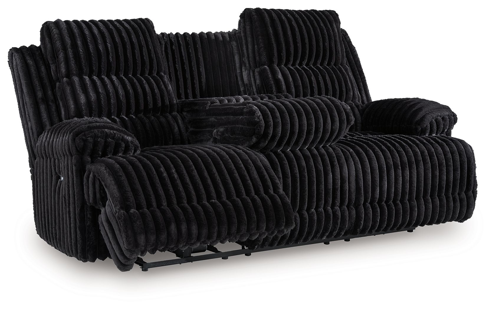 Black corduroy reclining sofa with extended footrest and thick, ribbed cushions