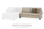 Light beige sofa section with left chaise, two back pillows, and textured accent cushions