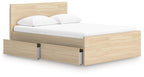 Light brown panel platform bed with underbed drawer panel on the side and tall headboard
