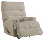 Upholstered rocking recliner chair with curved arms and thick cushioned footrest
