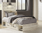 Youth bedroom bed set with light wood footboard drawers and gray bedding with pillows