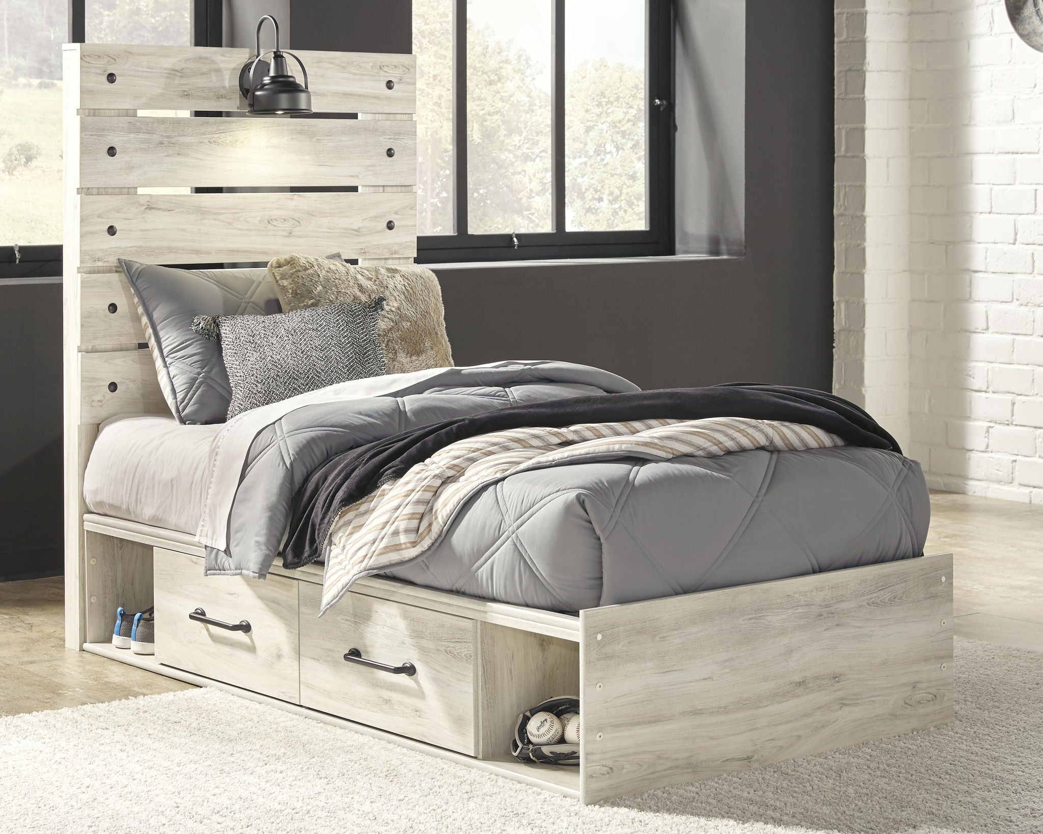 Light beige panel bed with two side drawers, white bedding, and throw pillows