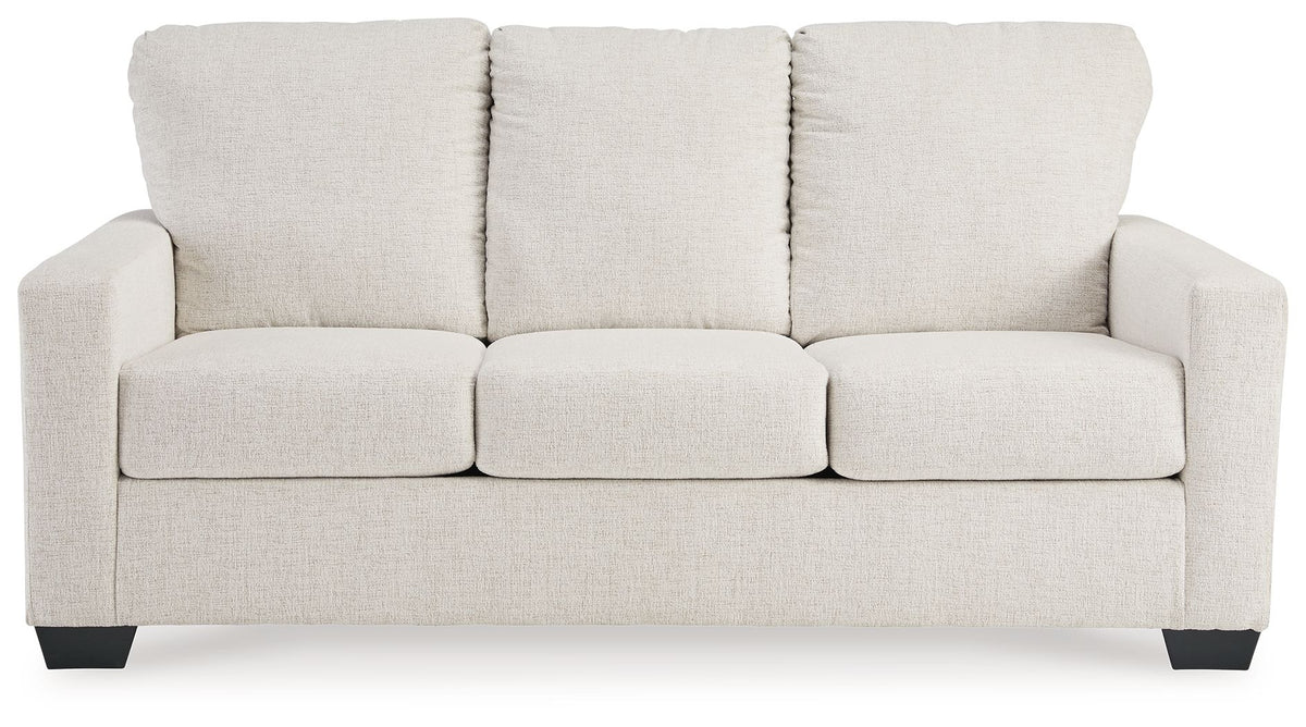 Beige sofa sleeper with three back cushions and boxy seat cushions