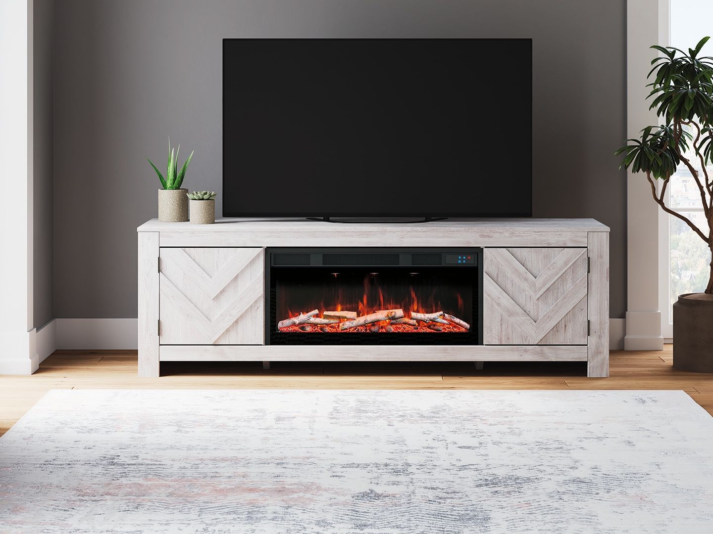 Light wood fireplace TV stand with open media shelf and burning fireplace insert