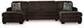 Chocolate sectional sofa with two chaise seats, dark cushions, and patterned accent pillows