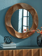 Brown round accent mirror with wavy wood frame and reflective glass center