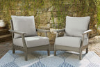 Gray outdoor lounge chairs with thick seat cushions and tall square back cushions