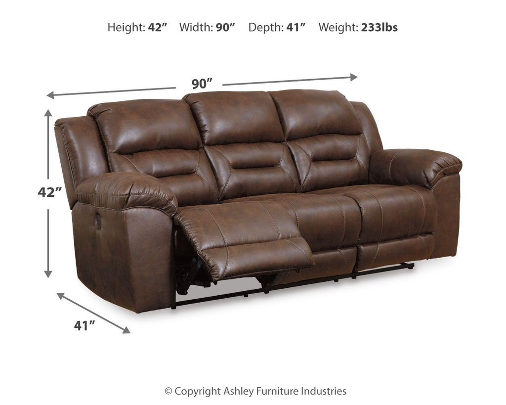 Brown power reclining sofa with padded arms and segmented back; side profile view.