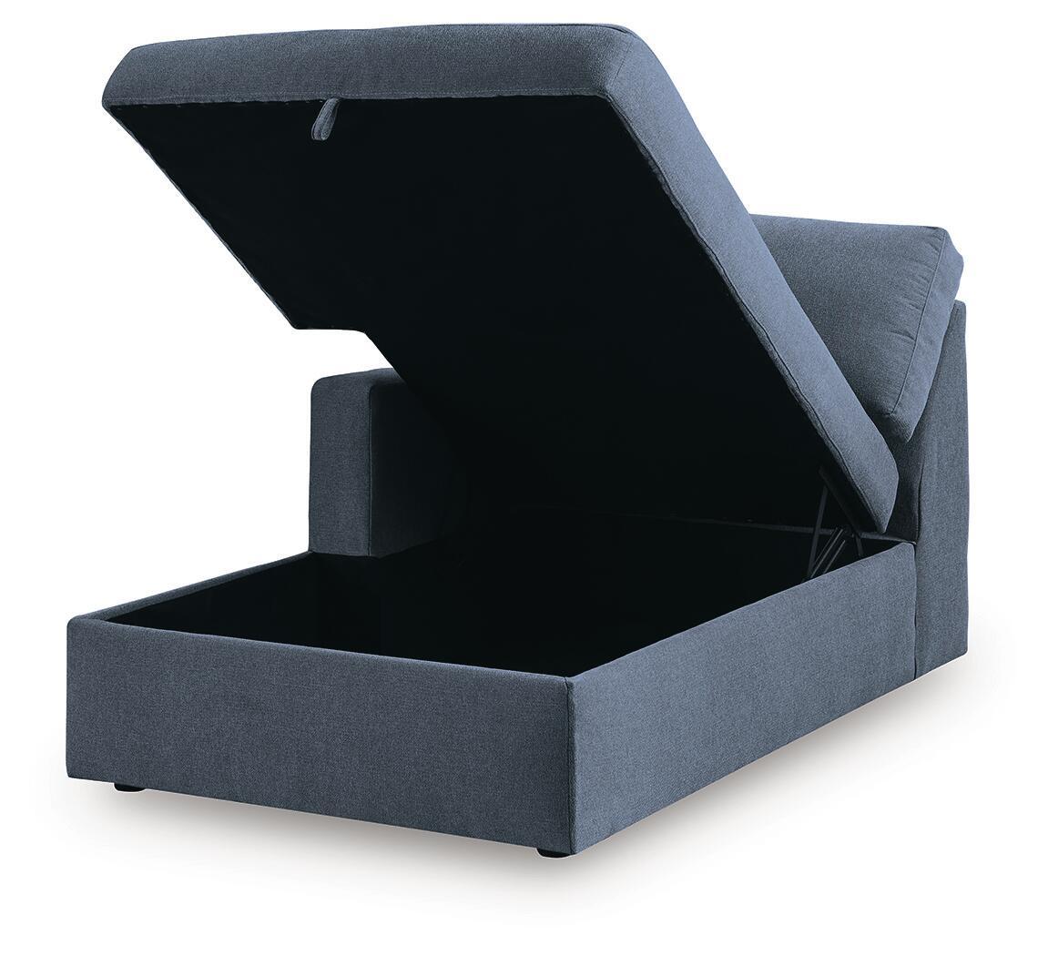 Ink blue corner chaise with storage, open lid showing inner compartment