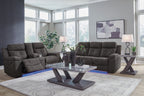 Dark gray reclining sofa and loveseat set with padded armrests
