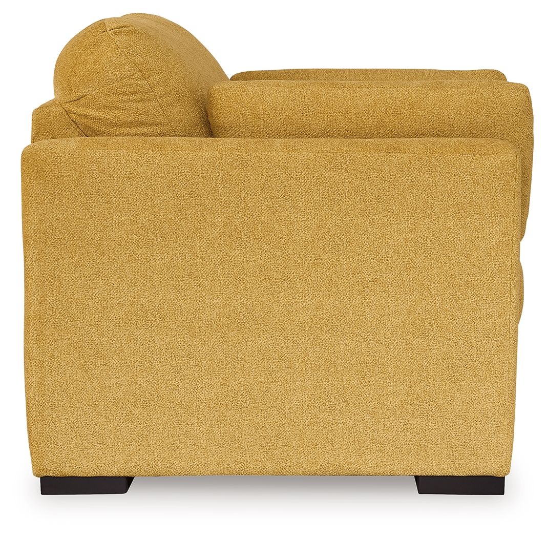 Yellow upholstered accent chair with rounded top back and dark feet
