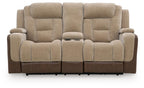 Two-tone power reclining loveseat with padded headrests and cushioned seats, front view.