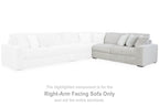 Light gray sectional sofa corner with ribbed upholstery and cushioned seat