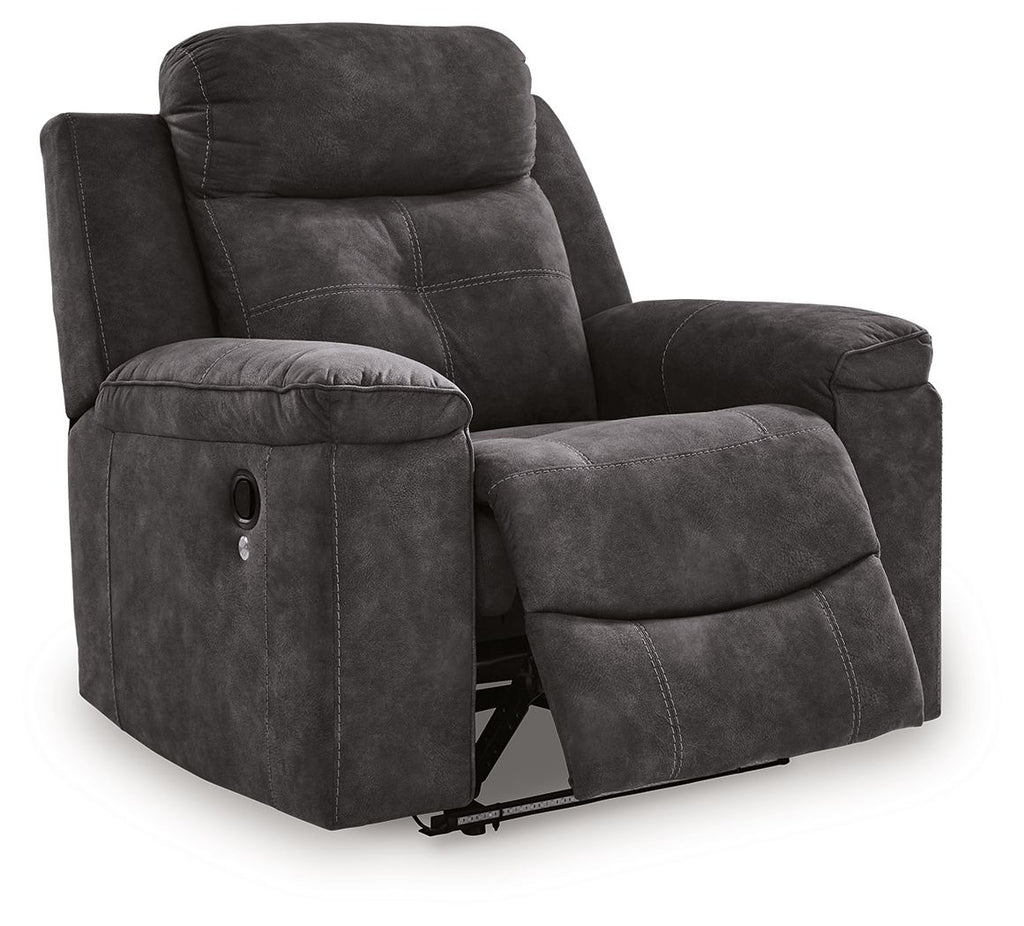 Charcoal zero-wall recliner with fold-down footrest, padded headrest, and cushioned arms