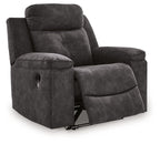 Charcoal zero-wall recliner with fold-down footrest, padded headrest, and cushioned arms
