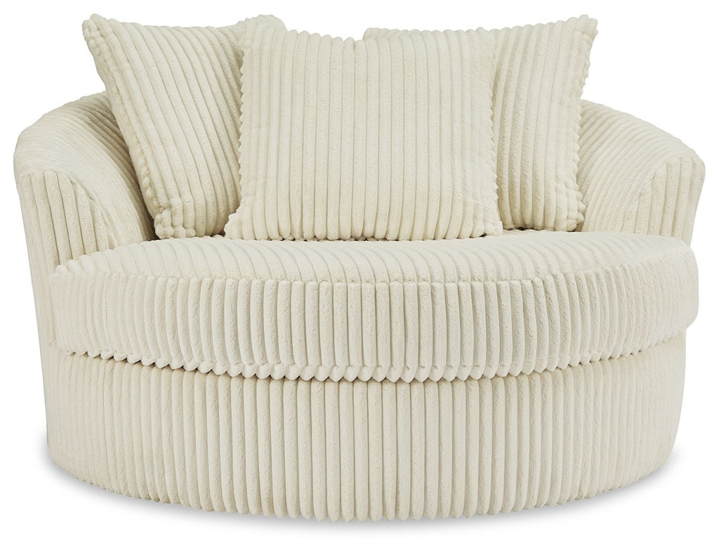 Beige oversized swivel accent chair with ribbed fabric and three seat-back pillows