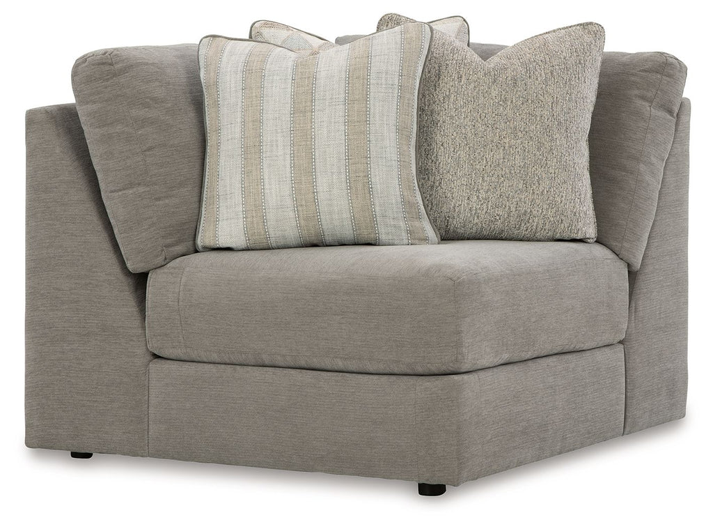 Gray upholstered wedge sectional sofa with rolled arms and two throw pillows