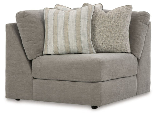 Gray upholstered wedge sectional sofa with rolled arms and two throw pillows