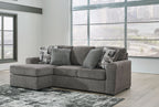Pewter fabric sofa chaise with chaise section, three back pillows and two patterned throws
