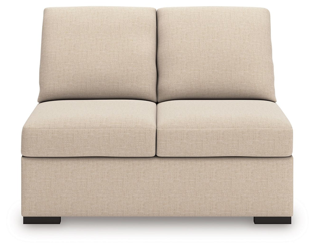 Armless loveseat in light beige upholstery, two back cushions, padded front base