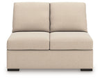 Armless loveseat in light beige upholstery, two back cushions, padded front base