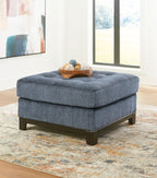 Blue oversized accent ottoman with tufted top and dark block feet