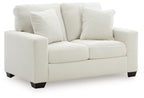 Upholstered loveseat with deep seat and three striped throw pillows, light upholstery