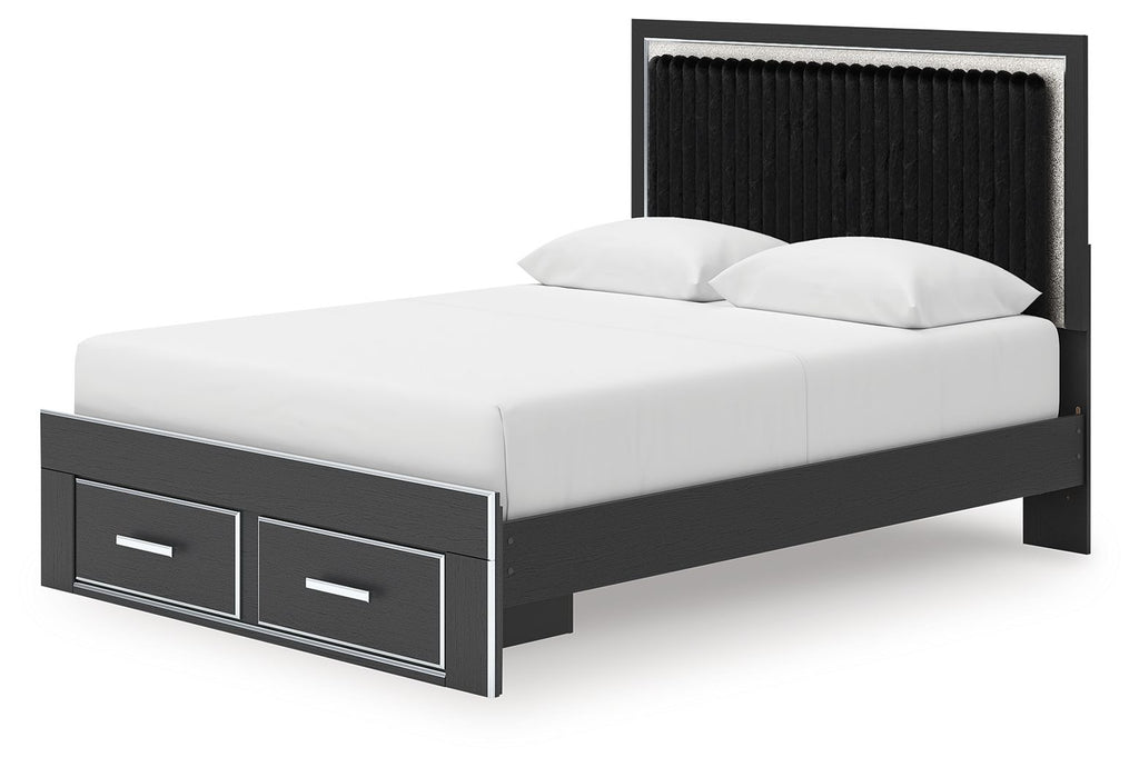 Black upholstered panel platform bed with storage drawers and slatted frame, side view
