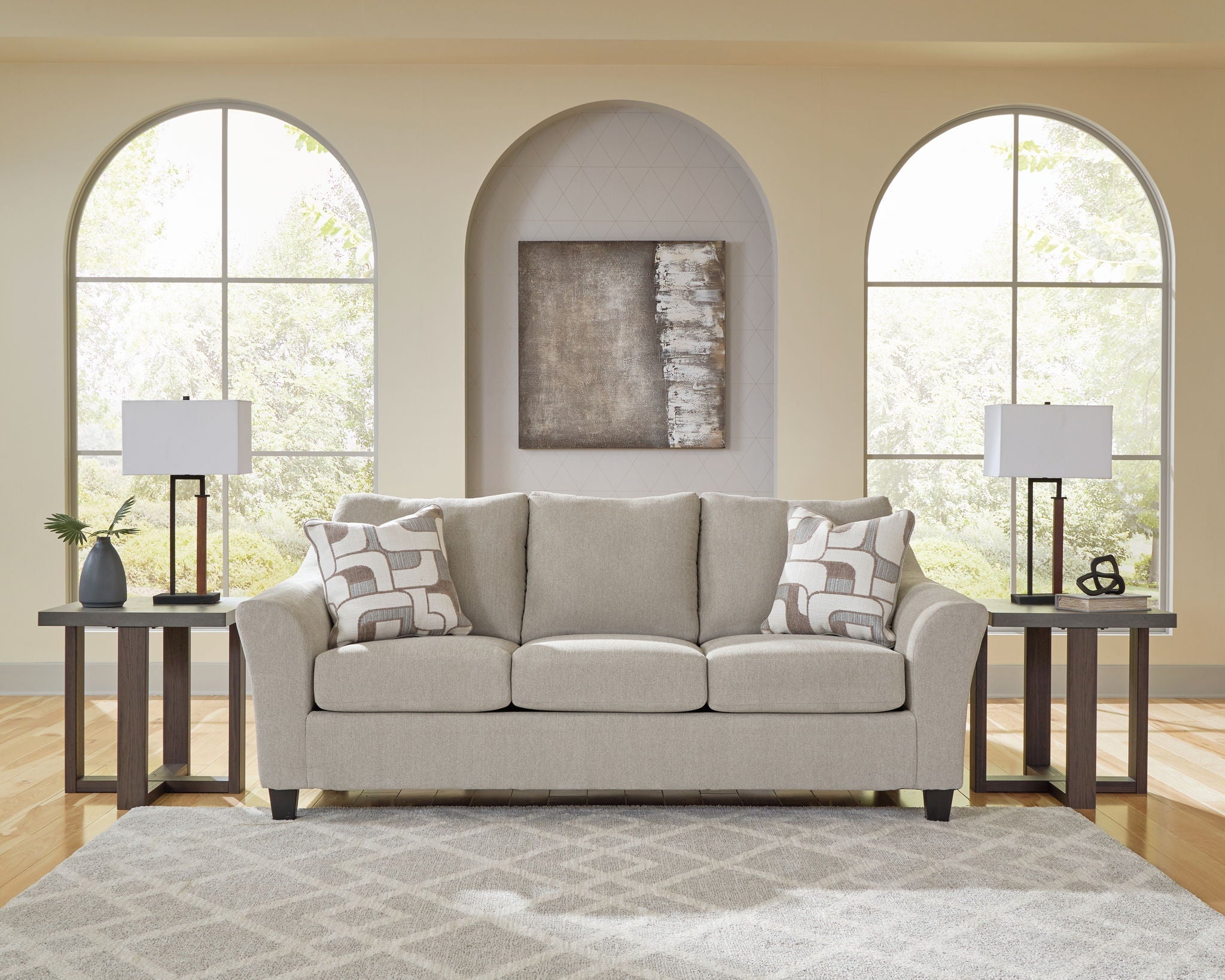 Taupe upholstered sofa with loveseat set, square arms, patterned throw pillows
