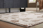 Geometric area rug close-up with ivory base and dark brown diamond lines, low pile