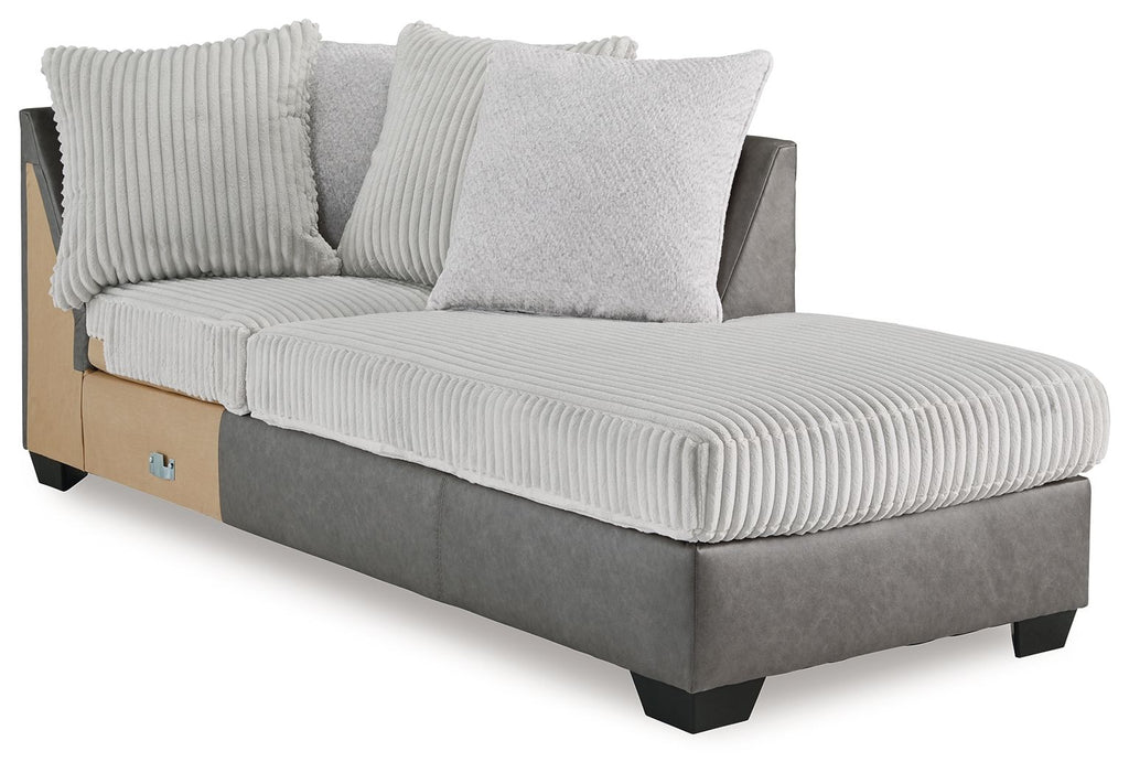 Corner chaise lounge with ribbed light gray fabric seat, two pillows, dark base
