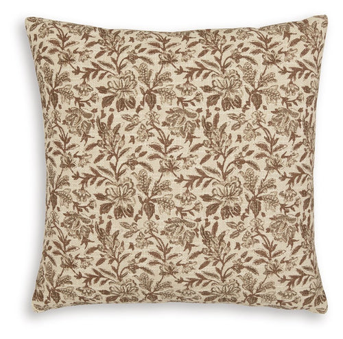 Decorative throw pillow with brown botanical pattern on beige fabric