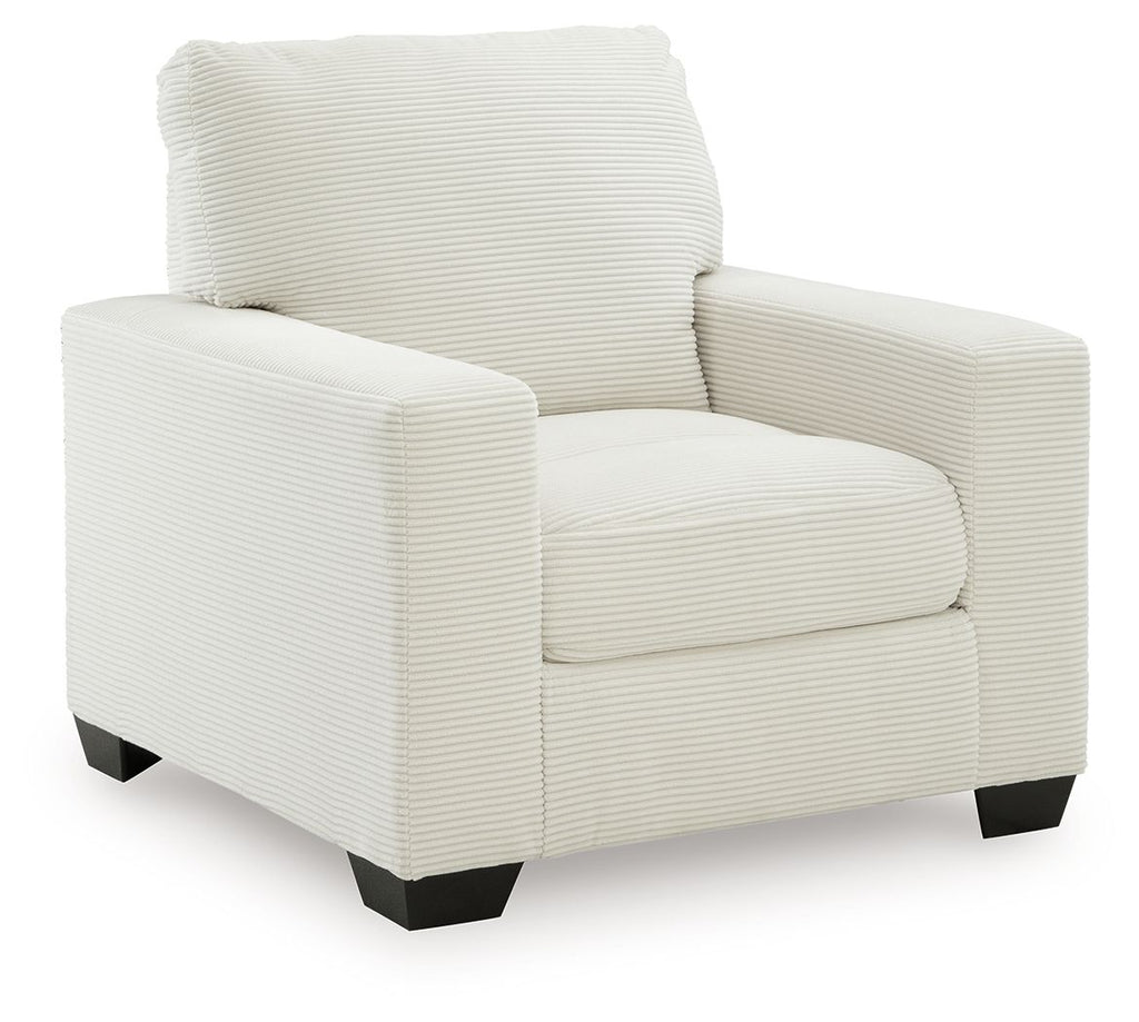 Upholstered armchair with striped fabric, rolled back, padded arms, and dark block legs.