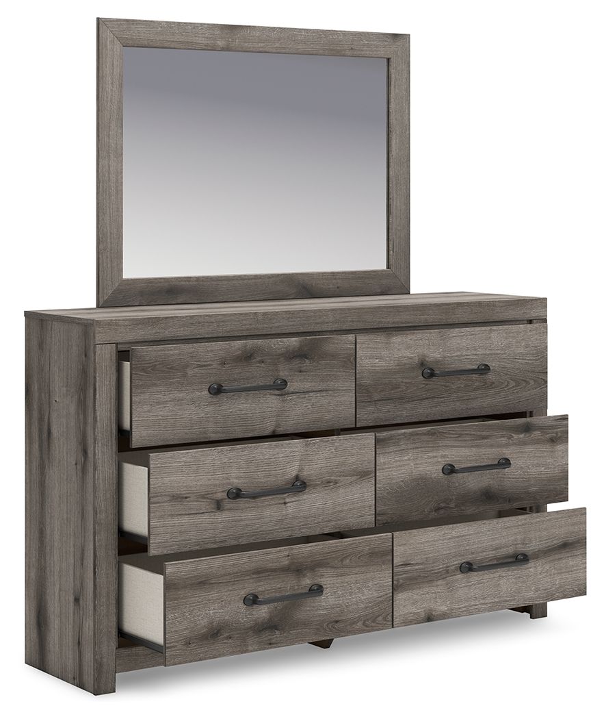 Gray-brown wooden dresser with mirror and six drawers, metal bar pulls