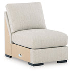 Pebble armless accent chair with textured light beige upholstery and padded seat
