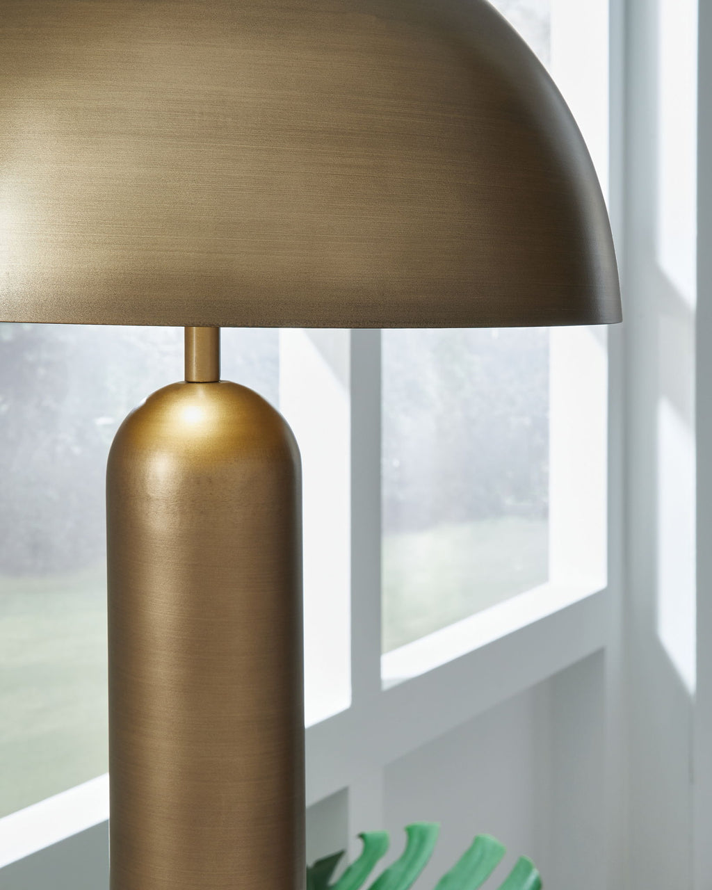 Metal dome shade with bronze finish and cylindrical lamp body