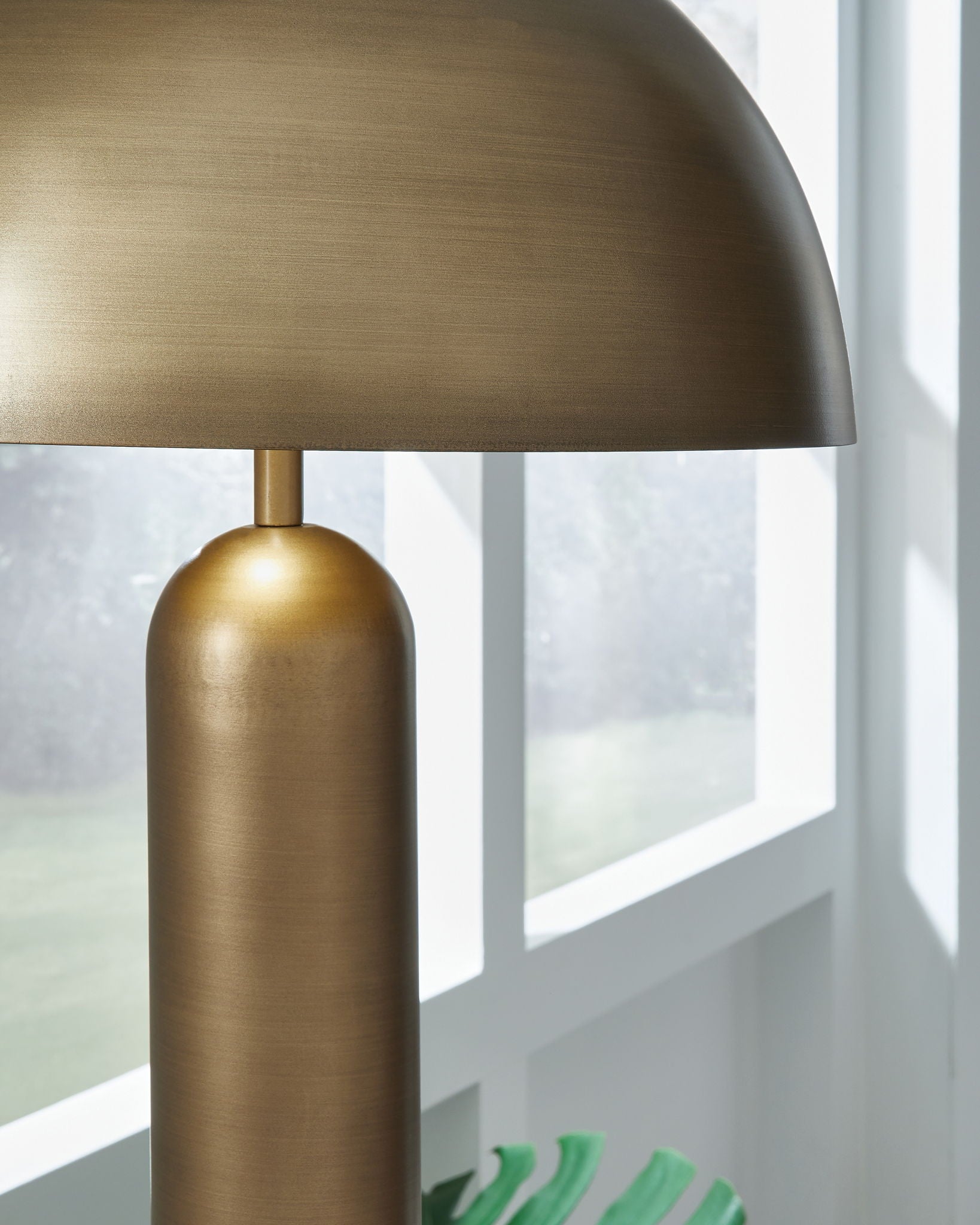 Metal dome shade with bronze finish and cylindrical lamp body