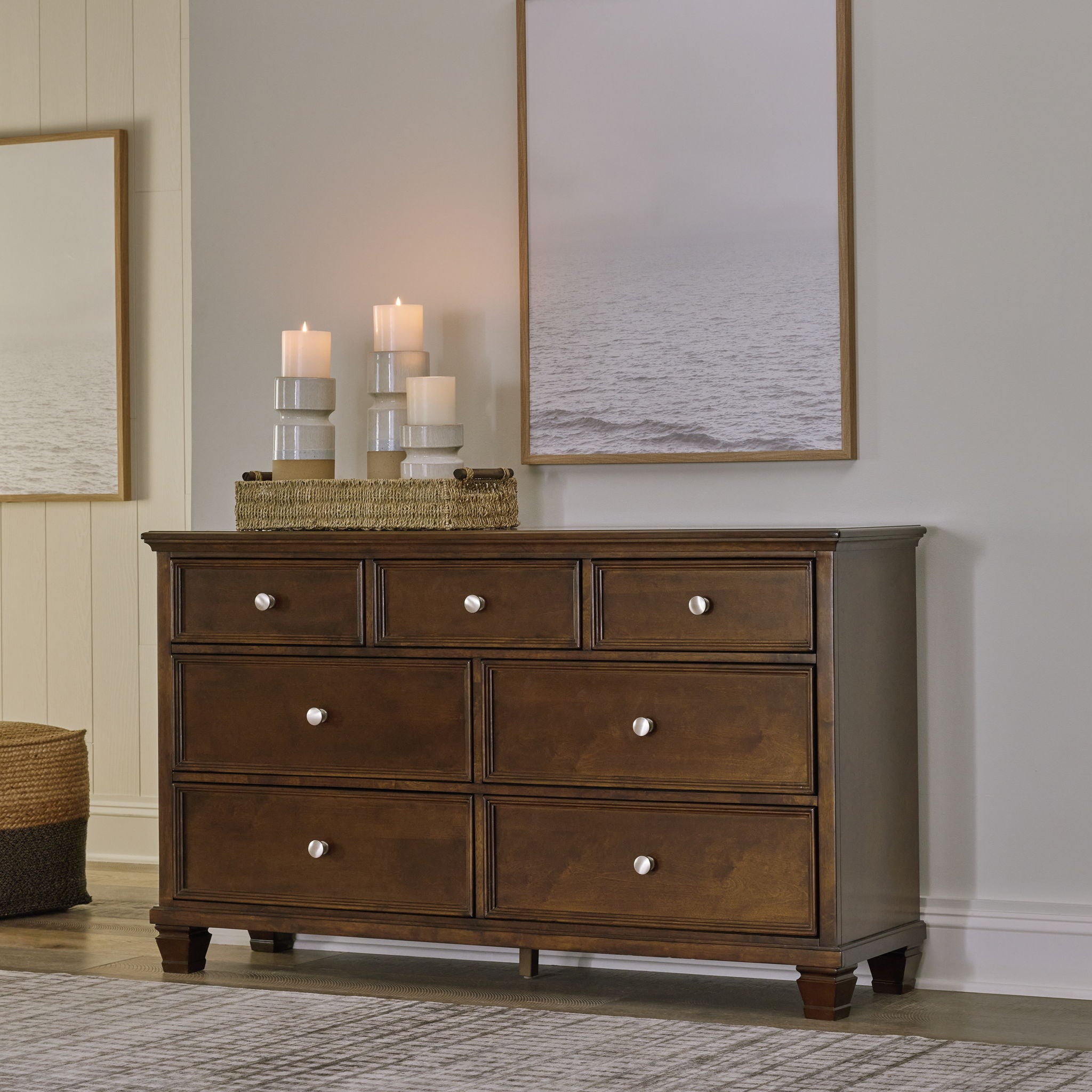 Dark brown dresser with six drawers and round metal knobs